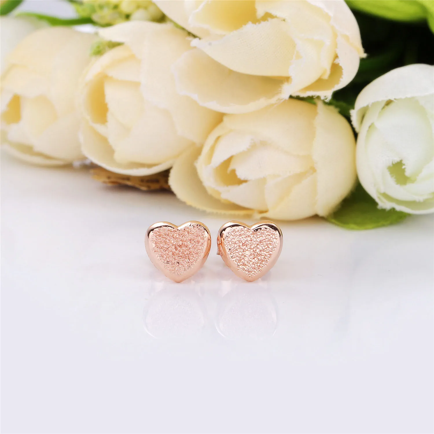 Heart stud earrings in diamond-pointed Pandora Rose - 287928