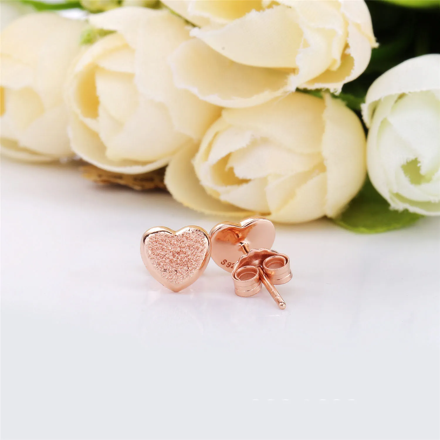 Heart stud earrings in diamond-pointed Pandora Rose - 287928